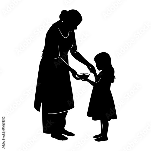 Woman teaching child to hold oil lamp silhouette girl