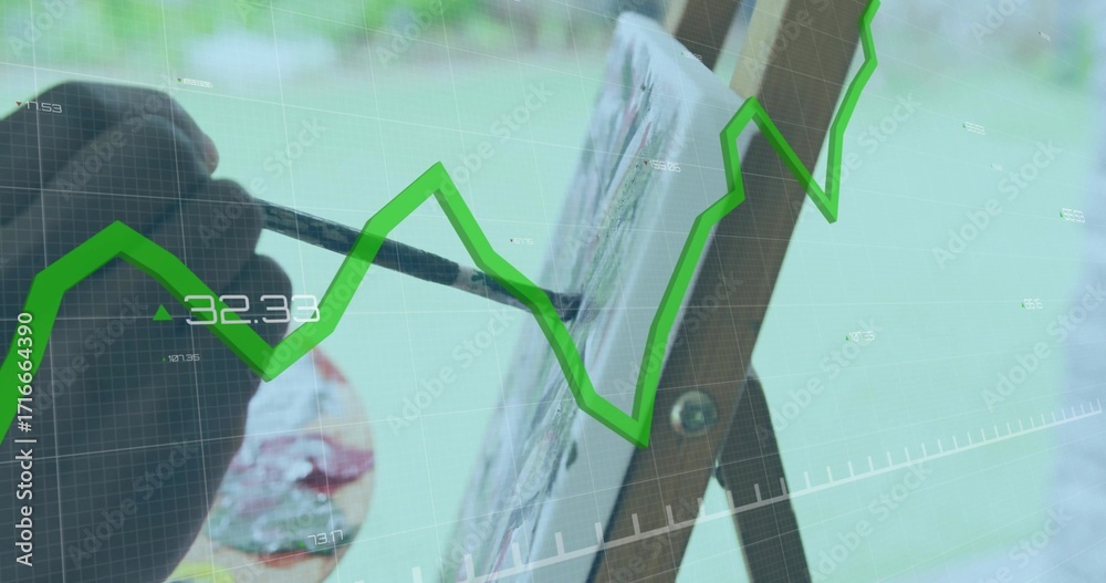 Naklejka premium Applying painter's hand painting canvas in studio with palette and paintbrush, green graph overlay