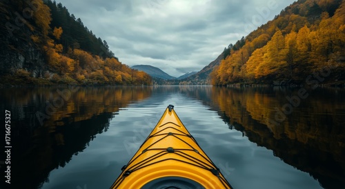 Kayaking on a Serene Lake Surrounded by Mountains and Autumn Trees in Cloudy ...