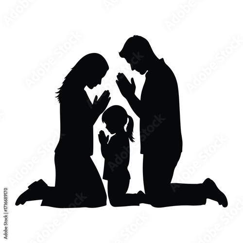 Family praying together on knees kneeling devotion