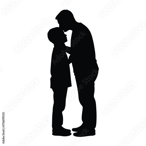Father kissing son silhouette forehead