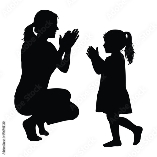 Mother and child clapping hands daughter