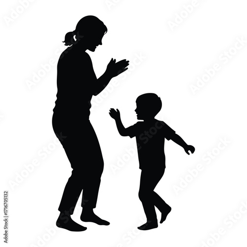 Mother and child clapping hands silhouette playing