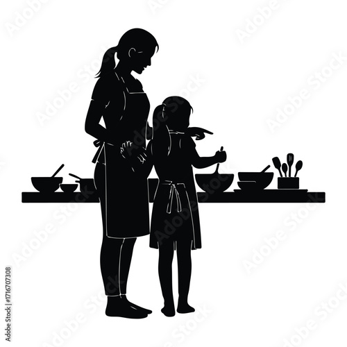 Mother and daughter cooking together kitchen apron