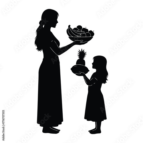 Mother and daughter sharing fruit bowl