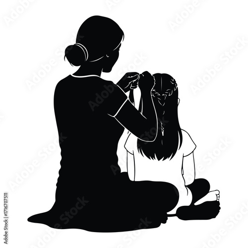 Mother braiding daughters hair family
