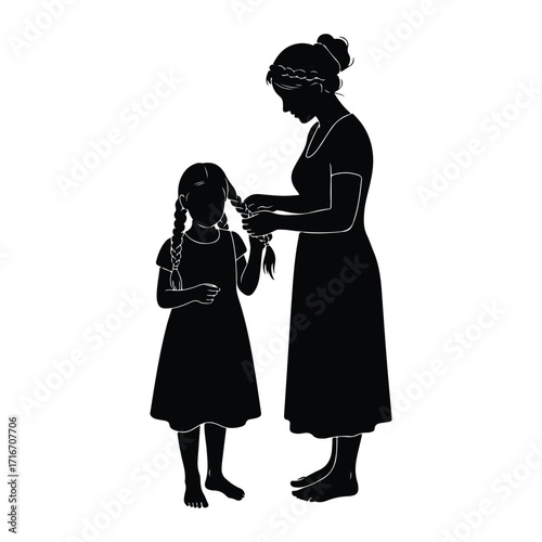 Mother braiding daughters hair pigtails
