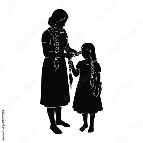 Mother braiding daughters hair family