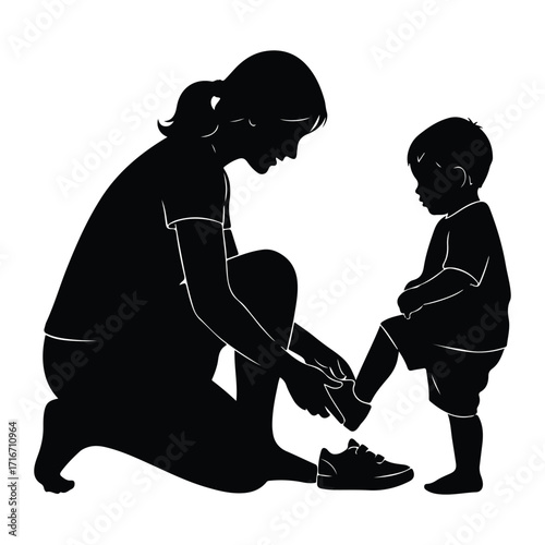 Mother tying childs shoe laces