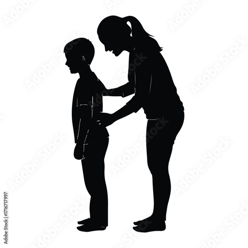 Woman adjusting boy's posture silhouette child