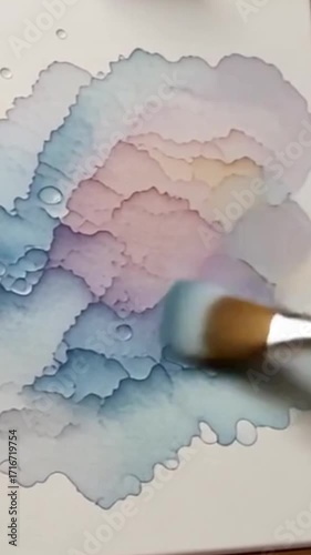 Soft watercolor textures — animated watercolor brush textures blending softly.