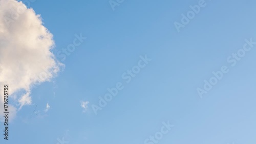 Bright clouds are flying across the sky. Timelapse
