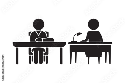 Two people sitting at desks in a formal meeting or interview setting
