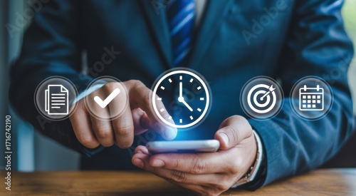 Mastering Time & Task Management: An individual is depicted in a tailored suit, interacting with a smartphone to effectively manage both time and tasks, underscored by integrated digital icons.