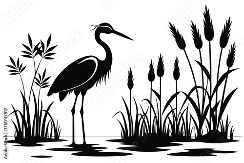 Silhouette of a heron wading amongst reeds and grasses in a tranquil waterscape