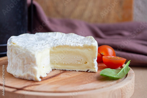 Camambert cheese on cutting board