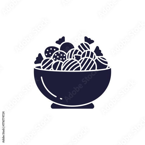 Bowl of assorted candies in dark silhouette style  