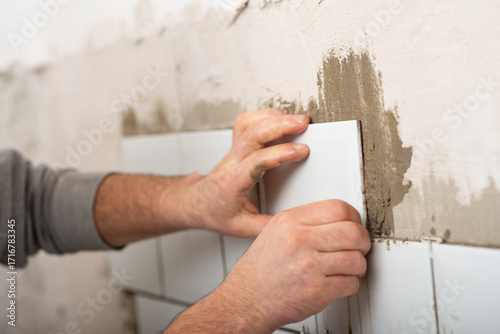repair and lay white tiles in the kitchen independently