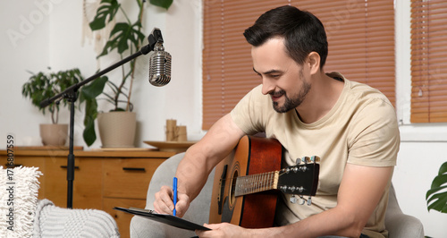 Young happy male composer w...
