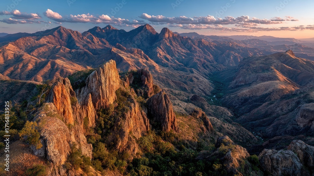 Fototapeta premium and keyword list based on the imageMountains Standing Tall Under Golden Sunset Light in a Rural Wilderness