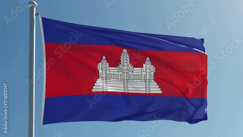 A realistic digital video of the Cambodia national flag waving proudly in the early morning, with clear blue sky in the background.