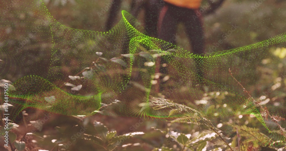 Fototapeta premium Floating neon green digital mesh wave weaving above forest floor, with ferns, leaves, hiking boots