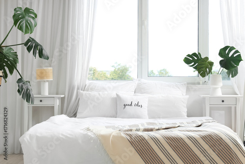 Interior of light bedroom w...