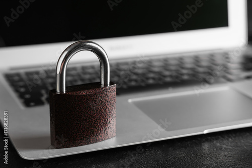 Padlock on laptop, closeup....