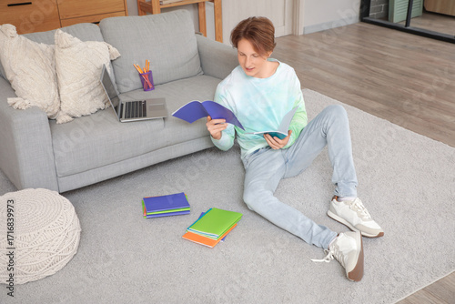 Male student with copybooks...