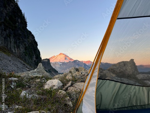 Tent in the mountains during sunrise