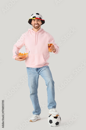 Male sports fan with snack ...
