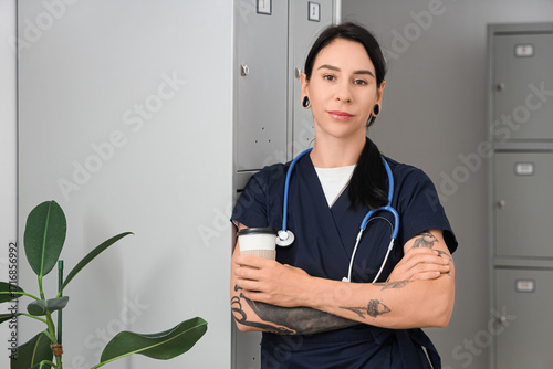 Tattooed female doctor with...