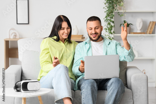 Young couple with laptop sh...