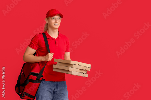 Male courier with bag and p...