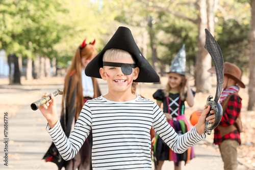 Little boy dressed as pirat...