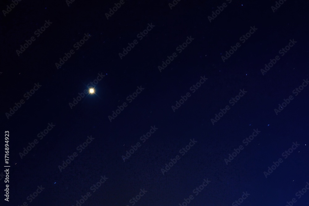 Fototapeta premium Warm Yellow Glow Amidst Deep Blue Night Sky - Simulated City Light, Lonely Star, Pure Blank Sky, Top Lighting, Glow Edges, Underexposed Upper Sky, Soft Warm-Cool Contrast