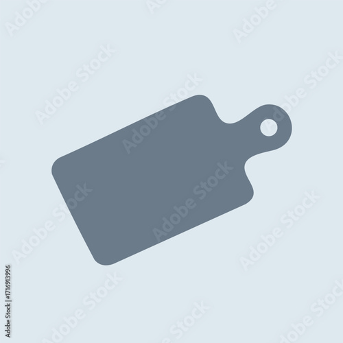 Rectangular gray cutting board with handle and hole for hanging isolated on light background