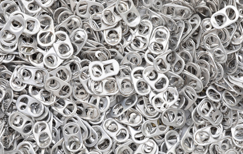 Pile of aluminium ring pull opener background.