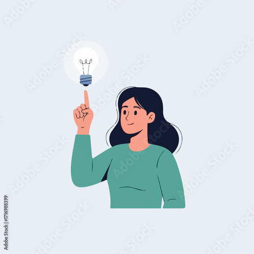 Woman with Dark Hair Points to Glowing Light Bulb Symbolizing Idea.