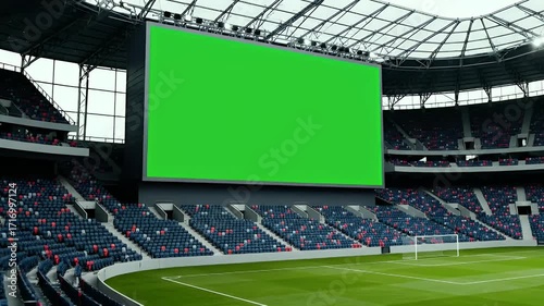 Modern sports stadium with large green screen jumbotron and empty seats, ready for custom content display