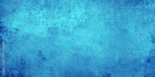 Textured blue wall with uneven paint strokes and darker patches, rough texture as an abstract texture background for template pages and banners.