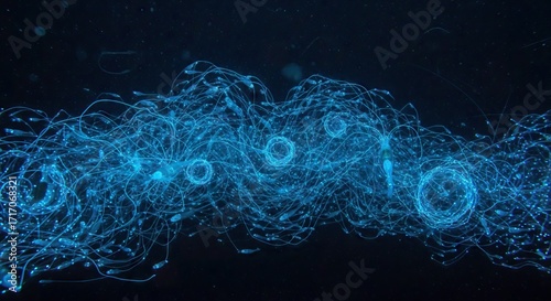 Bioluminescent siphonophores stream in the dark ocean their tentacles glowing blue