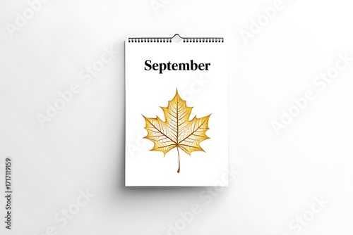 September calendar page with a watercolor autumn leaf illustration