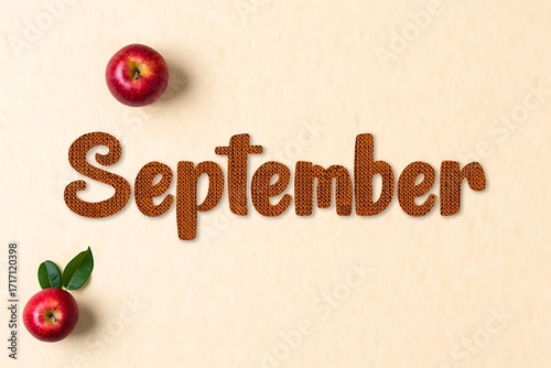 September word with apples and leaves on a light background