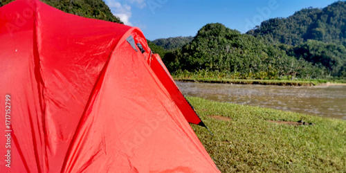 Outdoor Camping Tent Photo with Tropical Mountain and River Background