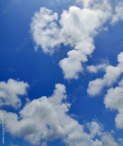 Beautiful cloudscape against a vibrant blue sky, perfect for backgrounds and nature concepts.