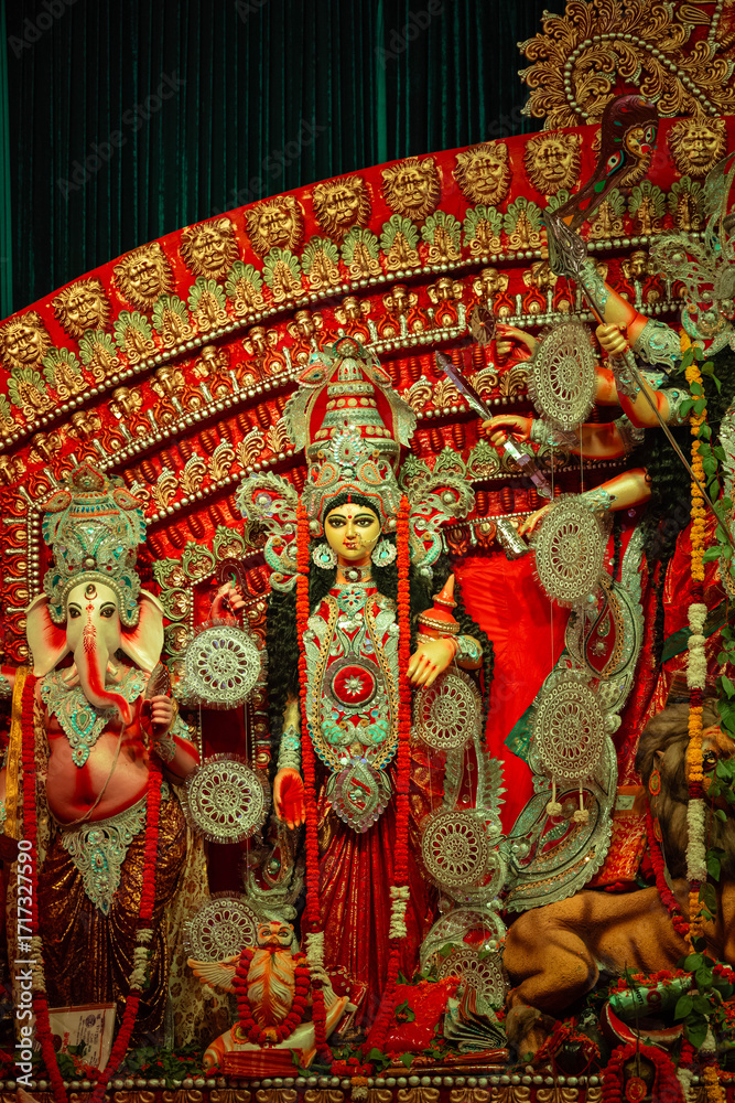 Fototapeta premium Subho mahalaya, An handmade idol of Goddess Durga decorated in colorful Pandal. 