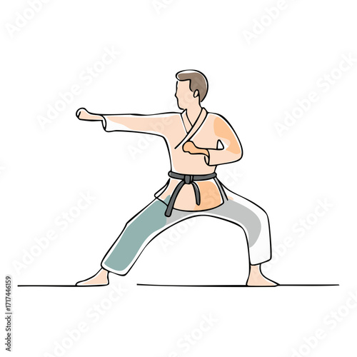 Man in a karate gi with a black belt practicing a punching technique in a fighting stance