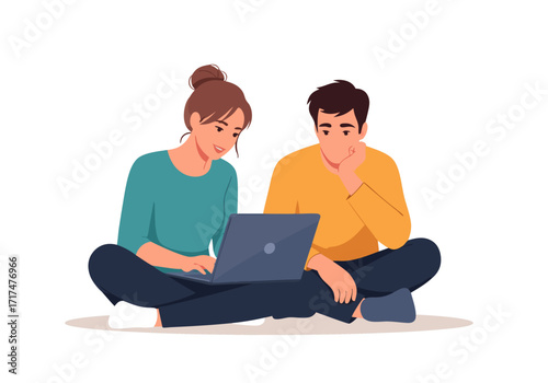 Man and woman sitting cross-legged working together on a laptop, online teamwork concept