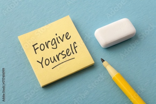 Inspirational Message on Sticky Note with Pen and Eraser on Blue Background for Self-Reflection and Personal Growth Concepts
